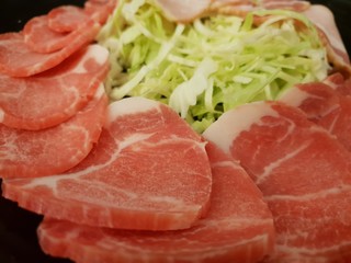 Top view, Set of raw pork slice on black background, Space for text in template, fresh meat for grill