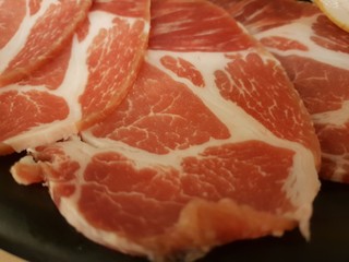 Top view, Set of raw pork slice on black background, Space for text in template, fresh meat for grill