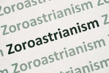 word Zoroastrianism printed on paper macro