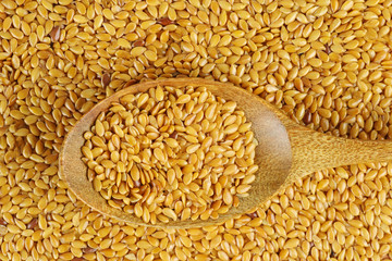 flax seeds in wooden spoon