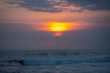 beautiful sunset over the sea wave ,in Bali Indonesia