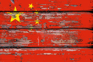 National flag of  China on a dull wooden background