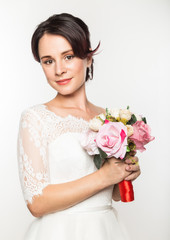 elegant bride with beautiful wedding bouquet in a hands. wedding make-up and hairstyle concept