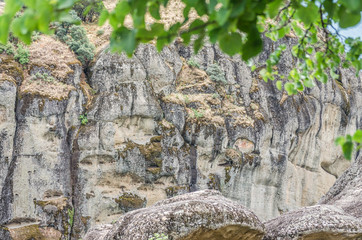 Kalambaka, Greece - June 10, 2018: Cracks and dents on a huge wall around the complex Platis Litos Orthodox Monastery of Great Meteora 