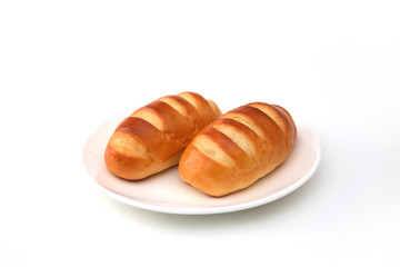 お皿にのせた ロールパン バターロール 白背景