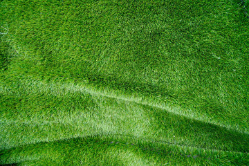 Fototapeta na wymiar artificial grass field crumpled background