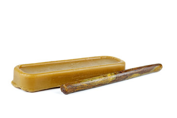 Brick of beeswax and stick of propolis