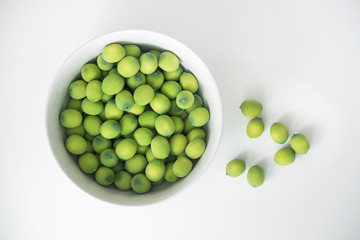 fresh lotus seeds in a cup isolated on white background