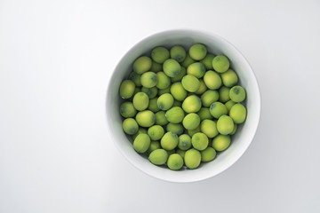 fresh lotus seeds in a cup isolated on white background