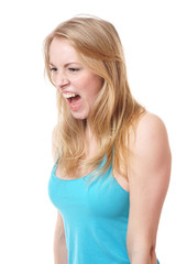 Fototapeta premium side view of a furious young woman screaming and looking down 