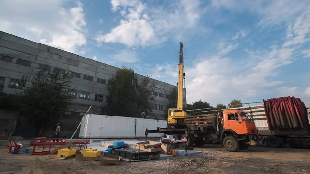 time lapse substation construction site with workers and crane