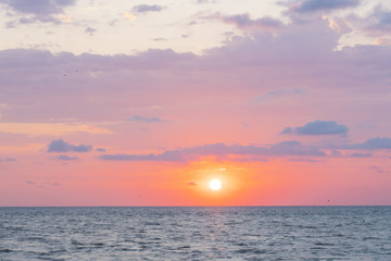 Naklejka na ściany i meble Sunset on the beach. Background, texture