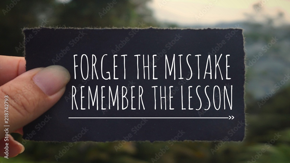 Wall mural motivational and inspirational quote - ‘forget the mistake, remember the lesson’ written on a black 