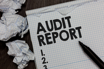 Text sign showing Audit Report. Conceptual photo An appraisal of complete financial status of a business Assets Marker over notebook crumpled papers ripped pages several tries mistakes.