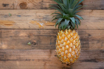 Pineapple on the wood  background