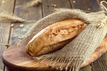 baked bread on wooden table background