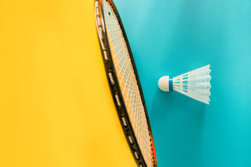 Volant and racket for playing badminton on yellow background. The concept of summer entertainment. Minimalism Pop Art - obrazy, fototapety, plakaty