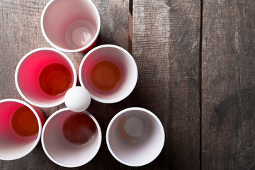 Game Beer Pong on wooden table
