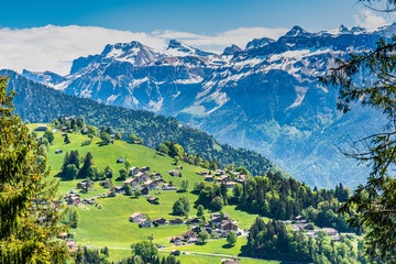 Switzerland, Beatenberg village and Alps view 