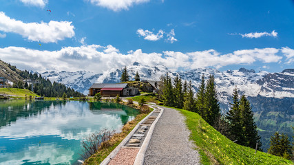 Fototapeta premium Switzerland, Engelberg buildings and Alps view 