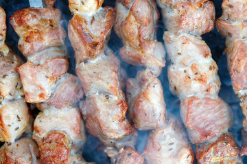 Barbecue skewers with meat on the brazier. Pork shish kebab