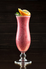 Strawberry smoothie on dark background