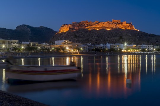 Blue hour at Haraki (Charaki) overlooking the harbor and the castle in the distance, Rhodes Island, Greece