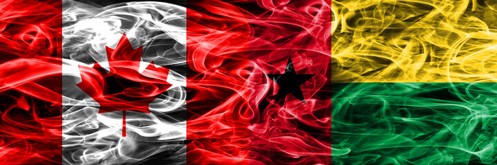 Canada vs Guinea Bissau smoke flags placed side by side. Canadian and Guinea Bissau flag together