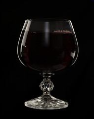 Glass still life image A glass of red wine in a glass on a black background
