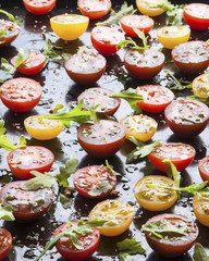 Trays of fresh different color cherry tomatoes ready to sun-dried, top view