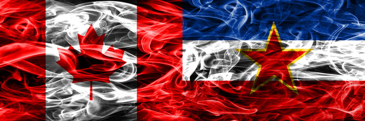 Canada vs Yugoslavia smoke flags placed side by side. Canadian and Yugoslavia flag together
