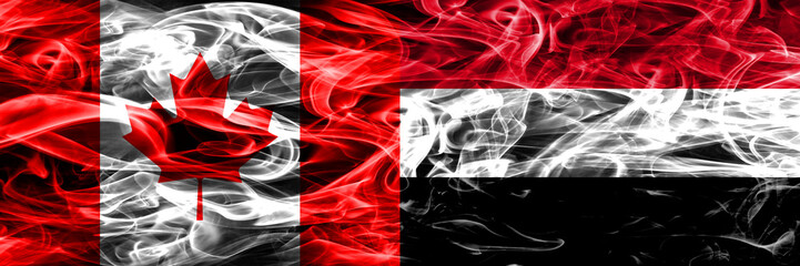 Canada vs Yemen smoke flags placed side by side. Canadian and Yemen flag together