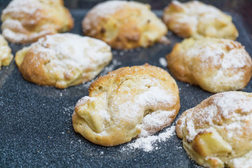 Homemade little apple cakes on baking tray
