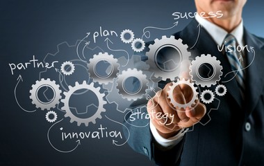 Businessman and  analytics symbols on  background