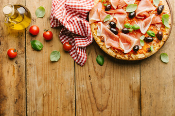 Italian pizza on wooden table