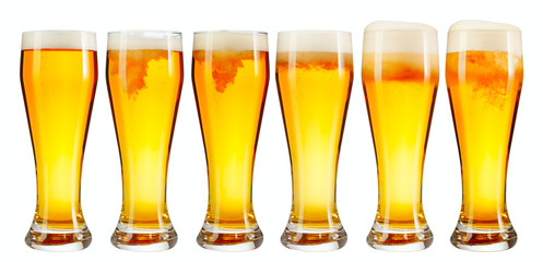 Set of a glass of cold light beer with foam isolated on white background
