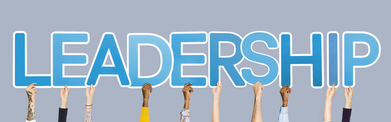 Obraz premium Hands holding up blue letters forming the word leadership