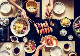 People eating Japanese food at restaurant