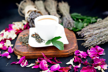 Cup of tea and mint on a dark background