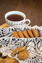 Homemade oatmeal cookies with raisins. Healthy biscuits. Morning cup of tea with oatmeal cookies.