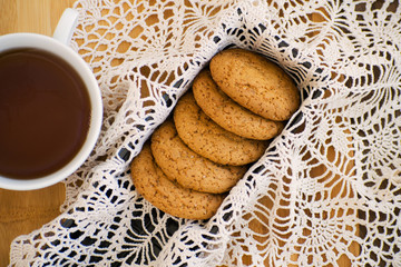 Homemade oatmeal cookies with raisins. Healthy biscuits. Morning cup of tea with oatmeal cookies.
