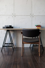 Chair and table on grey wall background. Job. Office. The interior is in art Nouveau style.