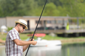 Fisherman organizing line on rod