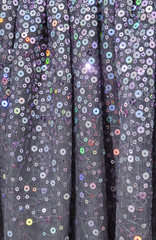 Close up photo of a sequined dress texture 