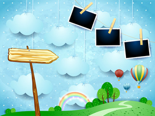 Surreal landscape with balloons, arrow sign and photo frames