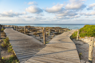 Wooden walkways to the beach of Formentera. Spain