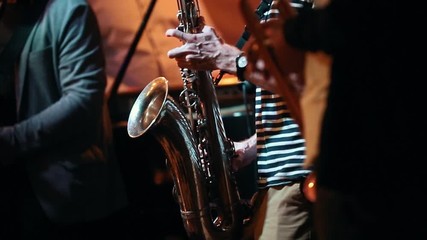 Four musicians from a jazz band play at a concert in a bar - Powered by Adobe