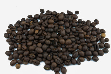 a coffee pile on a white background. grains of coffee.Isolator on white background. everyone loves coffee. morning with coffee.