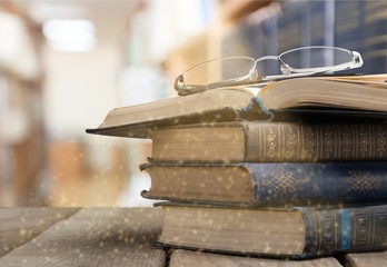 Old books on library background