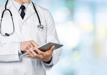 Close-up Doctor at hospital working with tablet pc